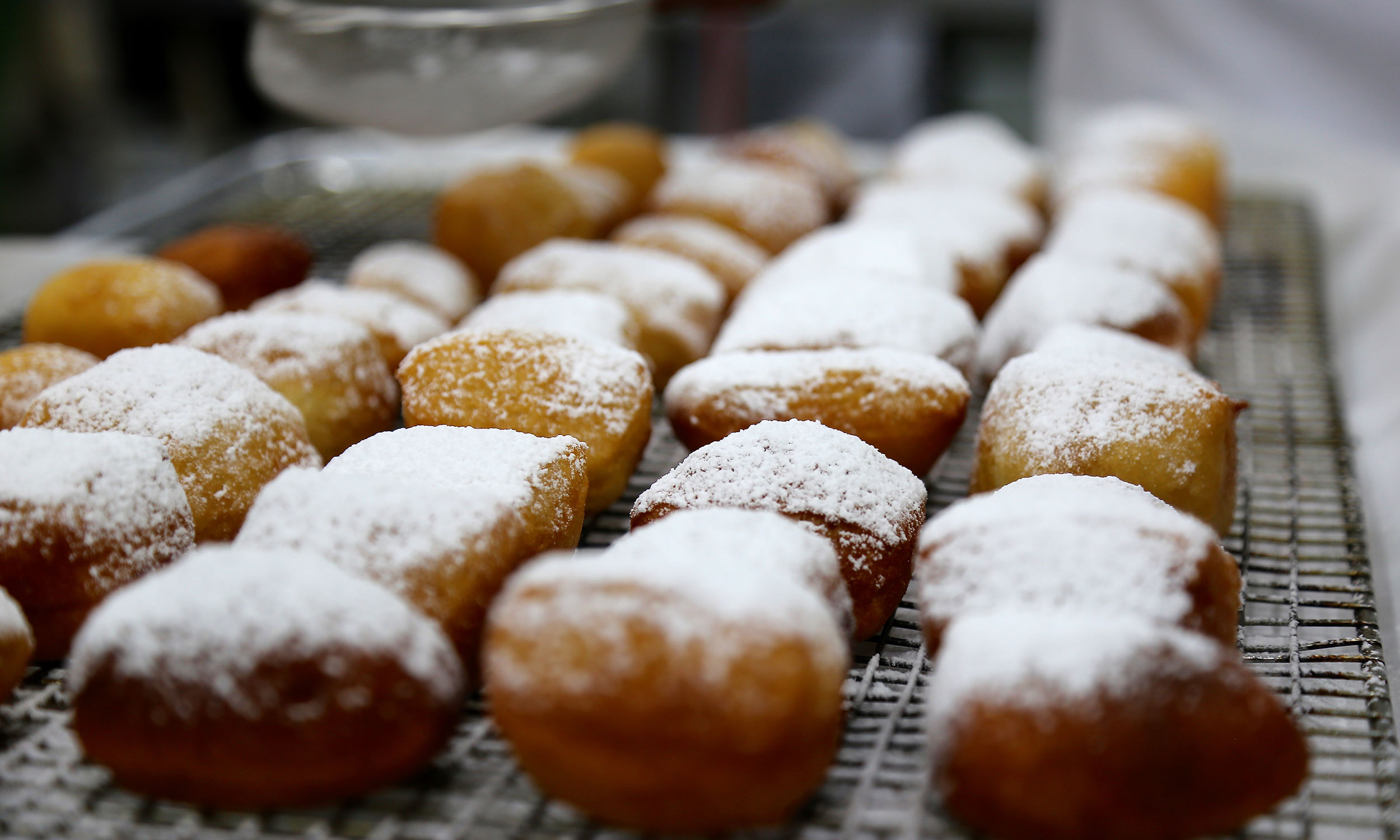 Give Your Beignets A Heavy Dusting Of Powdered Sugar For Bites of Heaven
