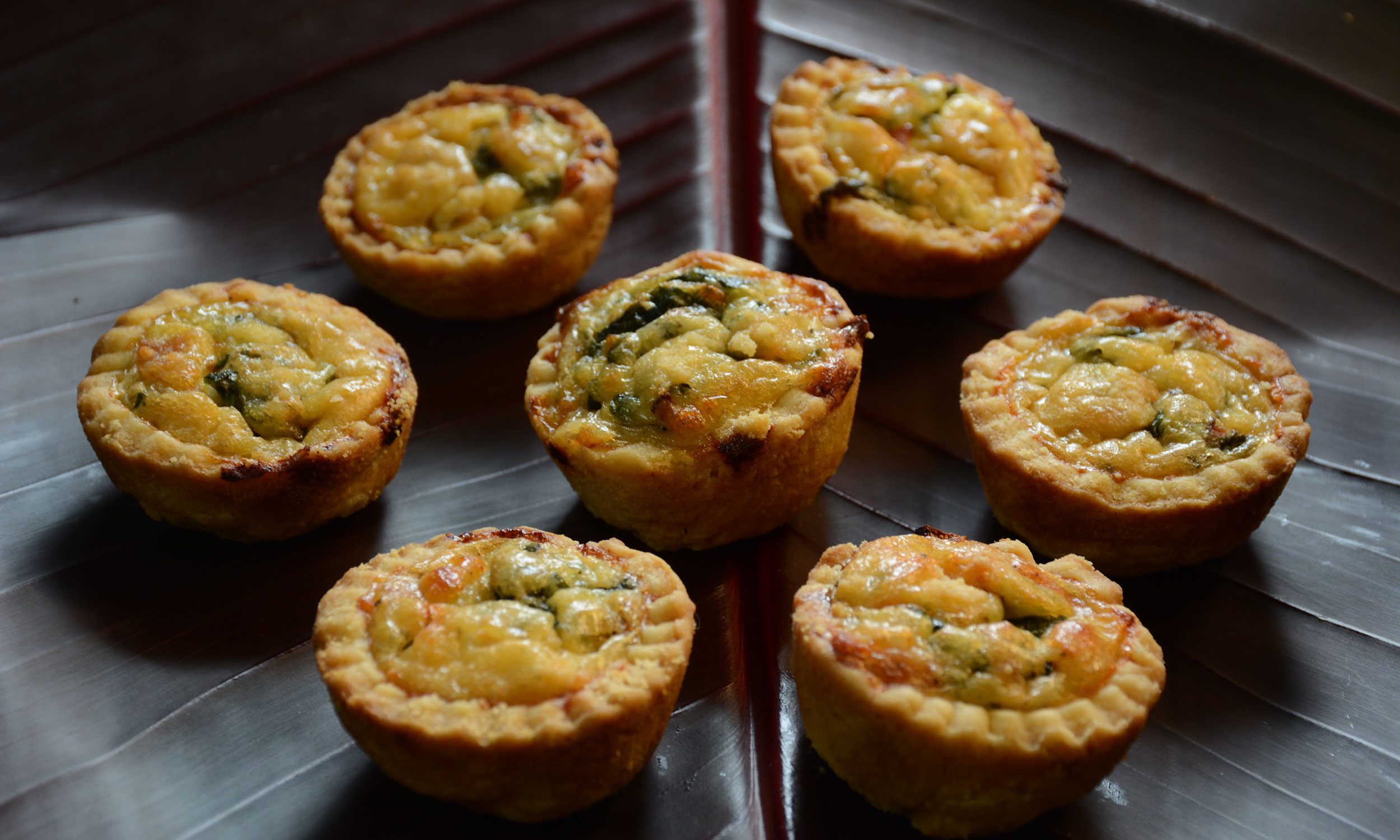 Bite-Sized Quiches With Spinach Are The Best Christmas Appetizer