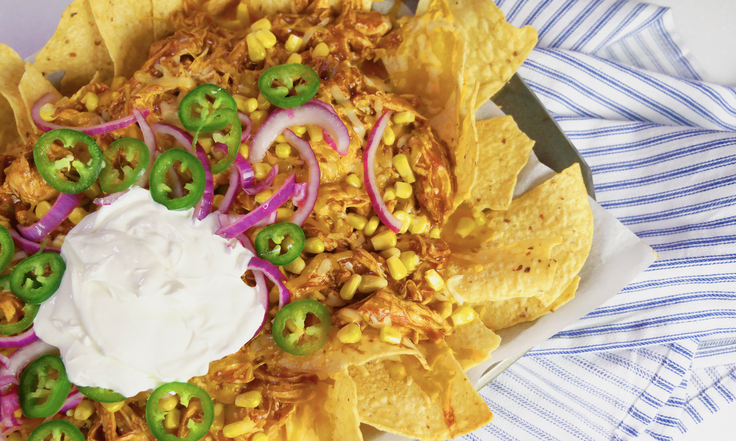Kick Your Nachos Up A Notch With BBQ Chicken and Pickled Onions